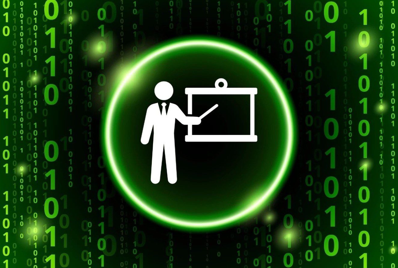 A green circle with a white icon of a man and a blackboard